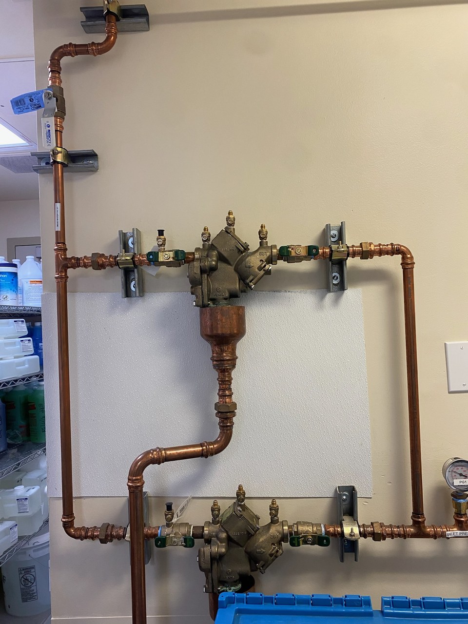 Backflow preventers by Livas Contracting Services, Katy TX: Two reduced pressure zone assemblies set in copper with test cocks and an air gap drain