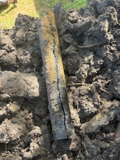 Sewer line by Livas Contracting Services, Katy TX: Split cast iron found in the trench