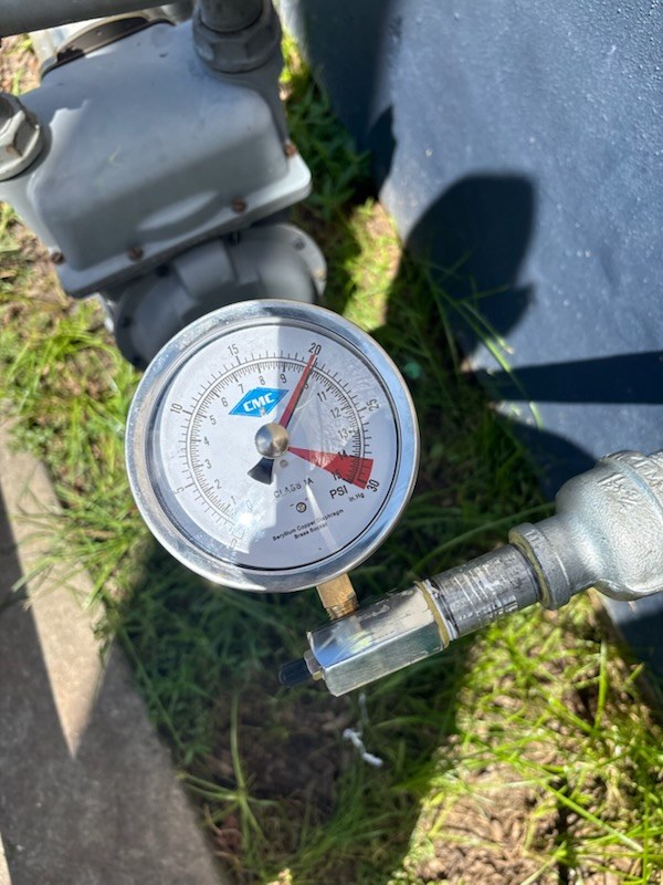Pressure test by Livas Contracting Services, Katy TX: Test gauge on the line, held under pressure to prove it is not leaking