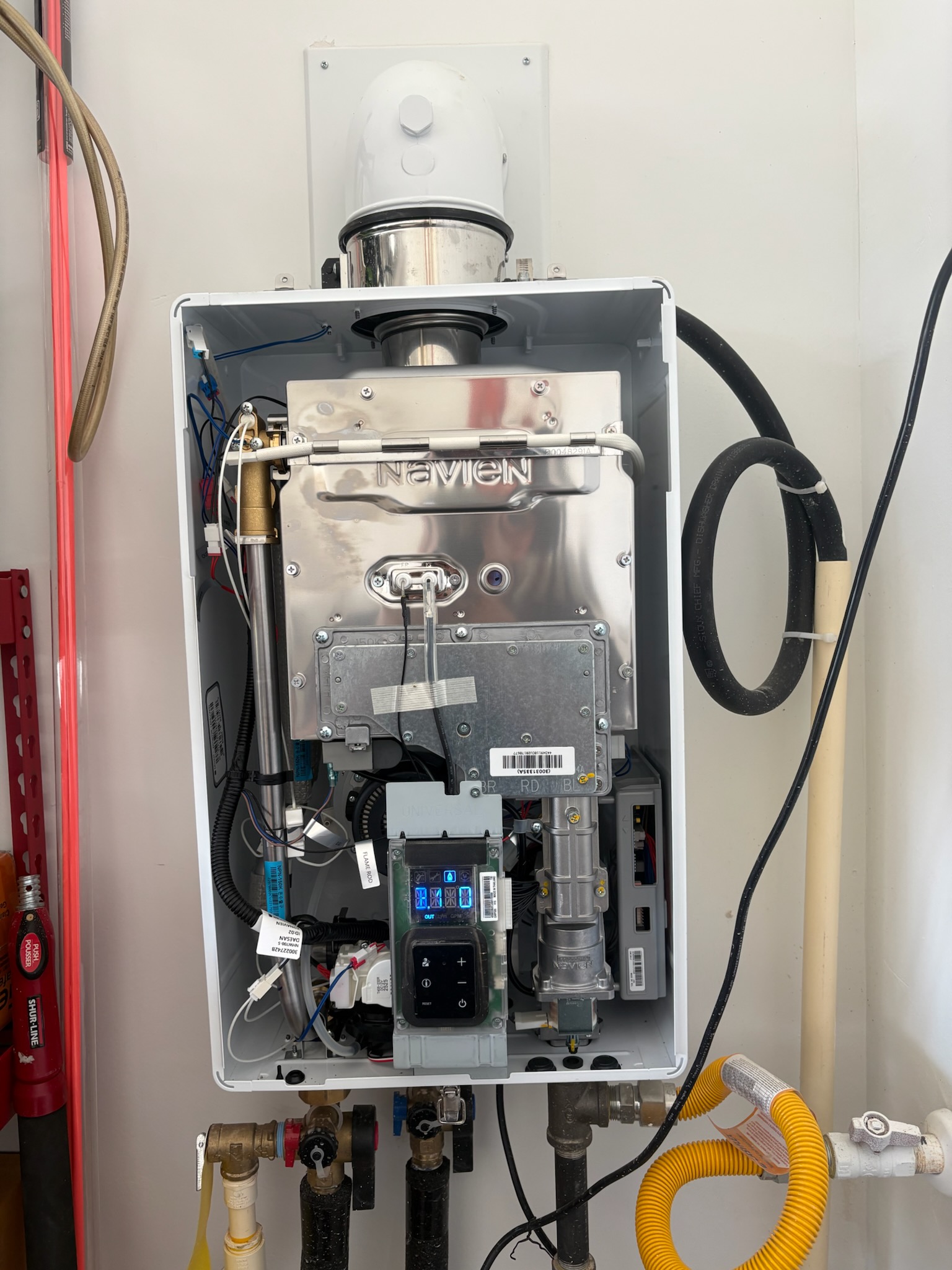 Tankless service by Livas Contracting Services, Katy TX: Navien opened up, checked and put back