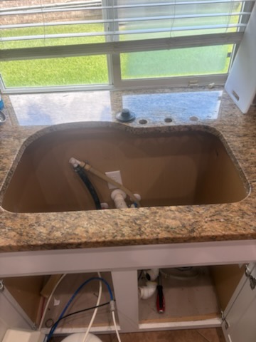 Sink replacement, before by Livas Contracting Services, Katy TX: Old sink out, cutout exposed