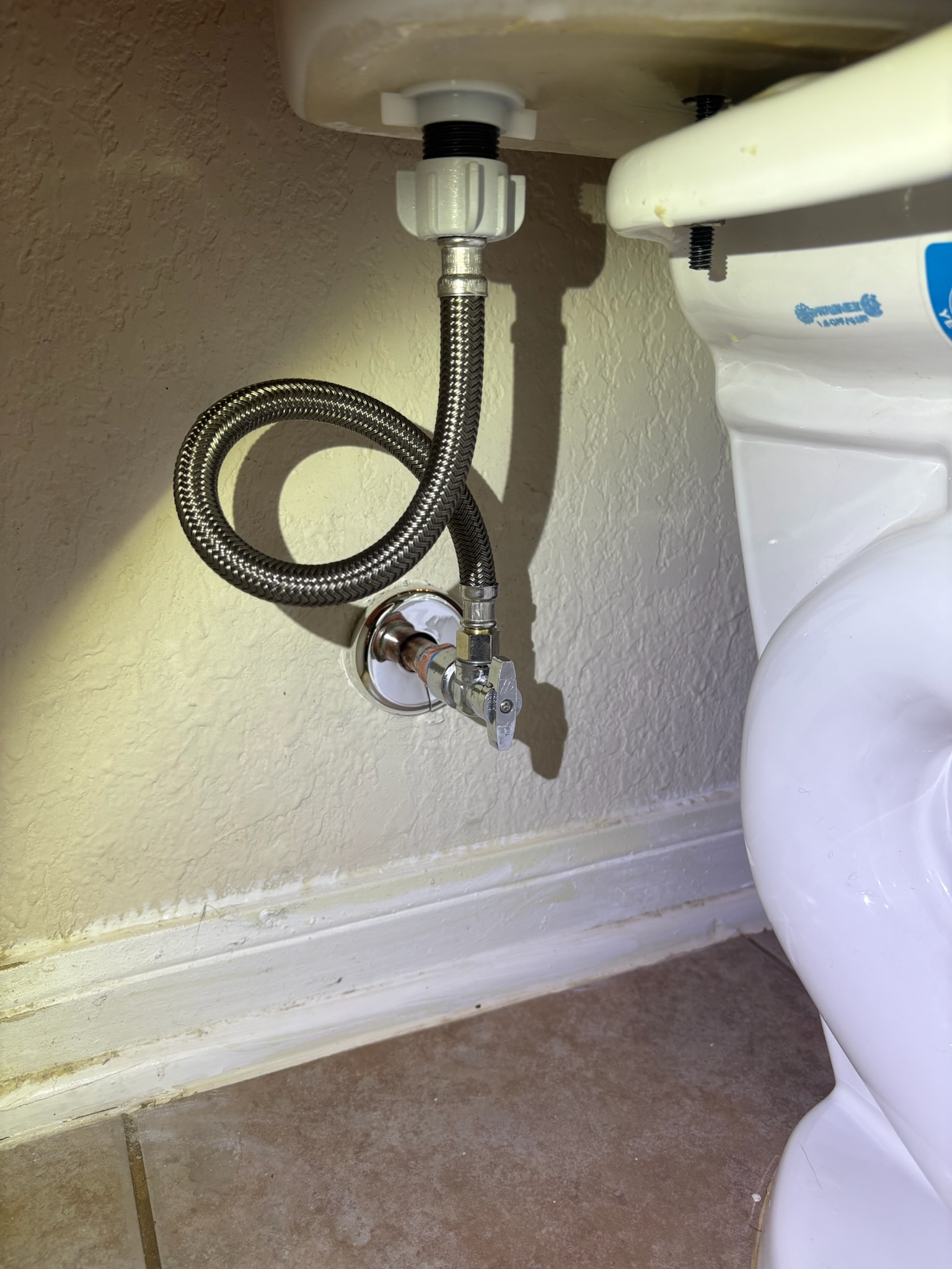 Toilet supply by Livas Contracting Services, Katy TX: New braided line and quarter-turn stop